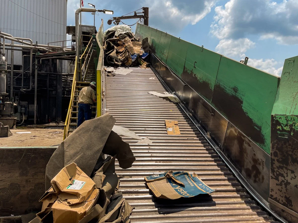 Conveyor systems at a recycling facility